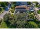 Aerial view showcasing a house with solar panels and a boat in the backyard at 790 7Th Ne Ave, Largo, FL 33770