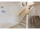 Basement stairs with carpeting and a white door at 790 7Th Ne Ave, Largo, FL 33770