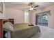 King-size bedroom with ceiling fan and backyard access at 790 7Th Ne Ave, Largo, FL 33770