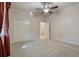 Bright bedroom featuring double doors and ceiling fan at 790 7Th Ne Ave, Largo, FL 33770