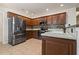 Modern kitchen with stainless steel appliances and wood cabinets at 790 7Th Ne Ave, Largo, FL 33770