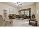 Spacious living room featuring brown sofas and a coffee table at 790 7Th Ne Ave, Largo, FL 33770