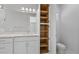 Bright bathroom with white cabinets, quartz countertop, and a large linen closet at 7214 Blossom Ave, Tampa, FL 33614