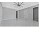 Bright bedroom with walk-in closet and ceiling fan at 7214 N Blossom Ave, Tampa, FL 33614