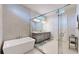 Elegant bathroom with soaking tub and walk-in shower at 8441 Ivy Stark Blvd, Wesley Chapel, FL 33545