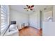 Secondary bedroom with wood floors and closet at 11101 58Th Street E Cir, Parrish, FL 34219