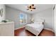 Bright bedroom with wood floors and a ceiling fan at 11101 58Th Street E Cir, Parrish, FL 34219