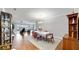 Elegant dining room featuring hardwood floors and a view to the living room at 11101 58Th Street E Cir, Parrish, FL 34219