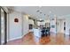 Open kitchen with island, stainless steel appliances, and hardwood floors at 11101 58Th Street E Cir, Parrish, FL 34219