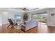 Open living area with hardwood floors, comfortable seating and sliders to backyard at 11101 58Th Street E Cir, Parrish, FL 34219
