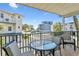 Relaxing balcony with outdoor seating, offering street views at 19807 Gulf Blvd # 128, Indian Shores, FL 33785