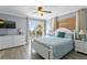 Main bedroom with balcony access, ocean view, and white dresser at 19807 Gulf Blvd # 128, Indian Shores, FL 33785