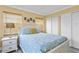 Guest bedroom with white platform bed and light blue bedding at 19807 Gulf Blvd # 128, Indian Shores, FL 33785