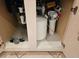 Under-sink plumbing and water filtration system at 2421 E Del Webb Blvd, Sun City Center, FL 33573