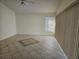 Bright living room featuring tile floors and window blinds at 2421 E Del Webb Blvd, Sun City Center, FL 33573