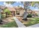Tan house with brown roof, walkway, landscaping, and large tree at 2582 Bentley Dr, Palm Harbor, FL 34684
