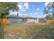 Backyard with wooden fence and large grassy area at 3612 W Leila Ave, Tampa, FL 33611