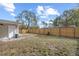 Large backyard with wooden fence and grassy area at 3612 W Leila Ave, Tampa, FL 33611