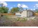 Backyard view of renovated home with wooden fence at 3612 W Leila Ave, Tampa, FL 33611