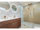 Modern bathroom with double vanity and large walk-in shower at 3612 W Leila Ave, Tampa, FL 33611