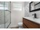 Updated bathroom with stylish vanity and walk-in shower at 3612 W Leila Ave, Tampa, FL 33611