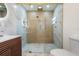 Modern bathroom with large walk-in shower and marble tile at 3612 W Leila Ave, Tampa, FL 33611