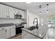 Modern kitchen featuring stainless steel appliances and granite countertops at 3612 W Leila Ave, Tampa, FL 33611
