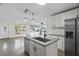 Updated kitchen with granite countertops and island at 3612 W Leila Ave, Tampa, FL 33611