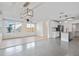 Open concept living and kitchen area with hardwood floors at 3612 W Leila Ave, Tampa, FL 33611
