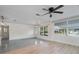 Open living area with hardwood and cement floors at 3612 W Leila Ave, Tampa, FL 33611