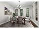 Formal dining room with wood table and gray chairs at 4911 Diamonds Palm Loop, Wesley Chapel, FL 33543