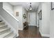 Bright entryway with tile flooring and staircase at 4911 Diamonds Palm Loop, Wesley Chapel, FL 33543