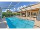 Inviting screened pool with water feature; perfect for relaxation at 5315 Cedarshake Ln, Valrico, FL 33596