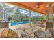 Enjoy this relaxing screened patio overlooking the sparkling pool at 5315 Cedarshake Ln, Valrico, FL 33596