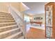 Carpeted staircase and hardwood floors leading to the upper level at 5315 Cedarshake Ln, Valrico, FL 33596