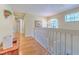 Bright and airy upstairs hallway with hardwood floors at 5315 Cedarshake Ln, Valrico, FL 33596