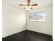 Bright bedroom with dark hardwood floors and a window at 6317 S Lansdale Cir, Tampa, FL 33616