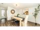 Bright dining room features a wood table with four chairs, and an accent wall at 6317 S Lansdale Cir, Tampa, FL 33616