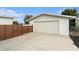 Detached garage with modern wooden fence at 6317 S Lansdale Cir, Tampa, FL 33616