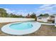 Inviting kidney-shaped pool with a large deck at 6317 S Lansdale Cir, Tampa, FL 33616