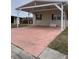 Covered carport with pink concrete driveway at 8343 Fantasia Park Way, Riverview, FL 33578