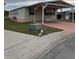 Mobile home with carport and landscaped lawn at 8343 Fantasia Park Way, Riverview, FL 33578