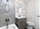 Modern bathroom with gray tile, vanity, and toilet at 10214 66Th Ave, Seminole, FL 33772