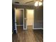 Bedroom with closet and wood-look floors at 11539 Gallatin Trl, Parrish, FL 34219