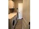 Laundry room with washer, dryer, and built-in cabinets at 11539 Gallatin Trl, Parrish, FL 34219