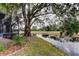 Backyard oasis with pond view and lush landscaping at 390 Cypress Creek Cir, Oldsmar, FL 34677