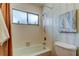 Small bathroom with shower/tub combo and window at 390 Cypress Creek Cir, Oldsmar, FL 34677