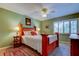 Bedroom with wooden bed frame and ceiling fan at 390 Cypress Creek Cir, Oldsmar, FL 34677