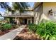 Inviting home exterior with landscaped walkway and porch at 390 Cypress Creek Cir, Oldsmar, FL 34677