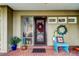 Front entry with decorative wreaths and brick flooring at 390 Cypress Creek Cir, Oldsmar, FL 34677